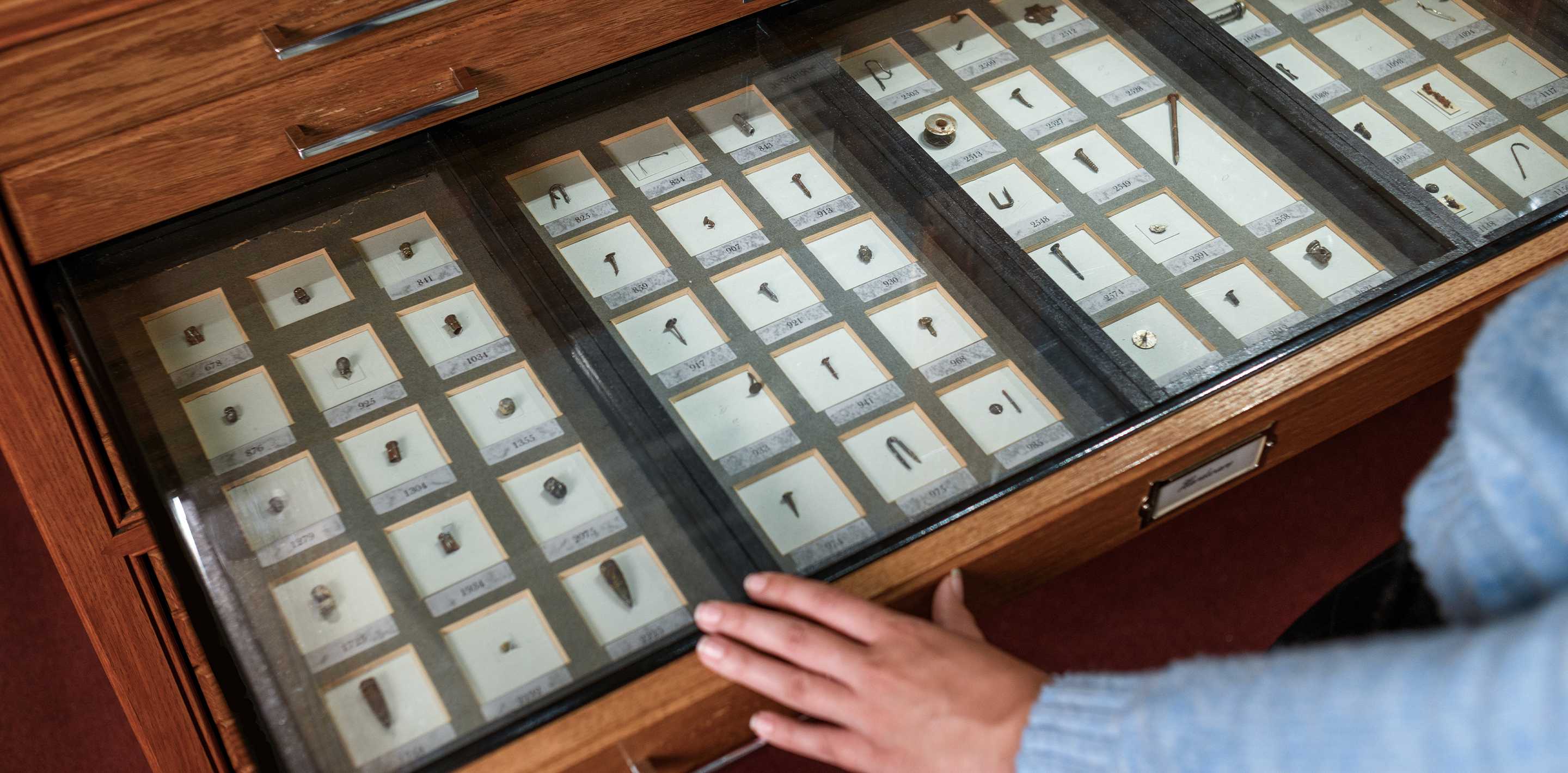Glass-topped drawers of catalogued objects from the Mutter Museum's Chevalier Jackson collection